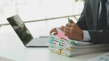 Financial analysts analyze business financial reports on a digital tablet planning investment project during a discussion at a meeting of corporate showing the results of their successful teamwork. video