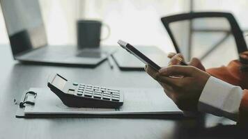 Financial analysts analyze business financial reports on a digital tablet planning investment project during a discussion at a meeting of corporate showing the results of their successful teamwork. video