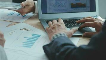 Financial analysts analyze business financial reports on a digital tablet planning investment project during a discussion at a meeting of corporate showing the results of their successful teamwork. video