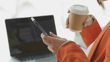 Financial analysts analyze business financial reports on a digital tablet planning investment project during a discussion at a meeting of corporate showing the results of their successful teamwork. video