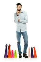 Handsome man with shopping bags photo