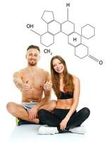 Athletic man and woman after fitness exercise with a finger up on the white with the chemical formula on background photo