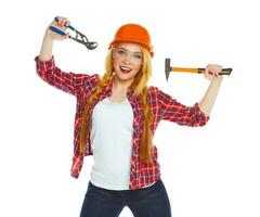 Young woman worker in helmet with the work tools on a white photo
