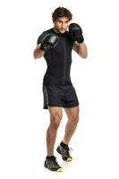 Athletic attractive man wearing boxing gloves on the white photo