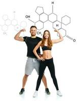 Athletic man and woman after fitness exercise with the chemical formula on background - concept of healthy life photo