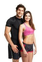 Athletic couple after fitness exercise on the white photo