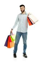 Handsome man holding shopping bags photo