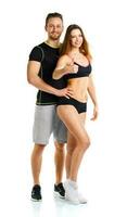 Athletic man and woman after fitness exercise with a thumb up on the white photo