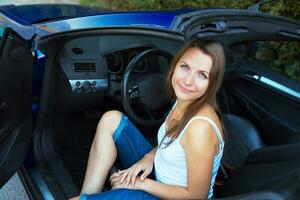 Caucasian woman in a cabriolet photo