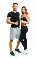 Athletic man and woman after fitness exercise with a finger up on the white photo