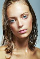 Gorgeous young girl with water drops on her face photo