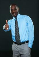 Young Businessman Showing Thumb Up photo