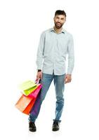 Man holding shopping bags. Christmas and holidays concept photo