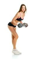 Beautiful athletic woman with dumbbells doing sport exercise, isolated on white photo