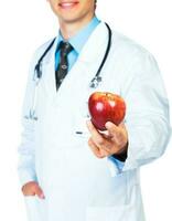 Smiling doctor holding red apple on white photo