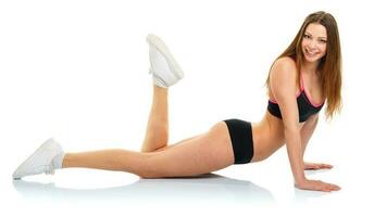 Happy athletic woman doing sport exercise photo