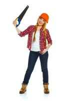 Funny woman in helmet with a saw on a white background photo