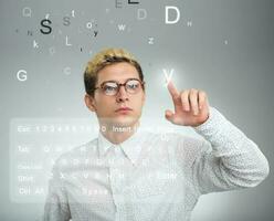 Businessman pressing application button on computer with touch screen photo