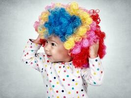 Baby with clown wig photo