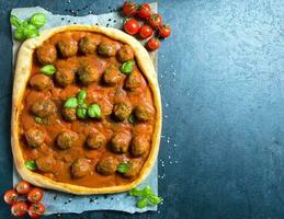 Meatballs pizza served photo