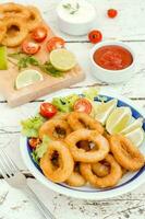 Fried calamari rings photo