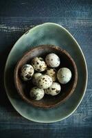 Quail eggs in plate photo