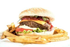 Huge cheeseburger and french fries photo