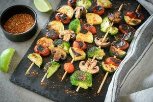 Served vegetarian skewers photo