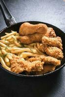 Fried chicken with french fries photo