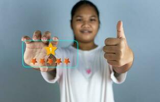 Hand choosing 5 star icon. represents feedback rating No. 1 and positive customer review. photo