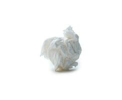 Single screwed or crumpled tissue paper or napkin in strange shape after use in toilet or restroom isolated on white background with clipping path photo