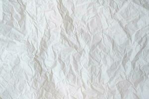 Wrinkled or crumpled white stencil paper or tissue after use in toilet or restroom with large copy space used for background texture in decorative art work photo