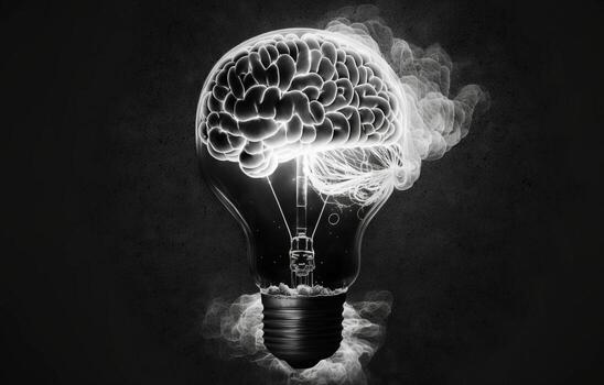 Lightbulb and Human Brain with Inside a lightbulb is a luminous human brain against a dark background. photo