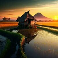 photo of a hut with mountain views and sunset in the rice fields