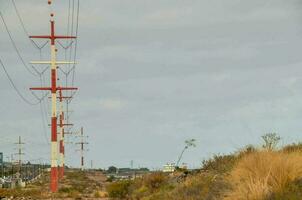 A field with electricity poles photo