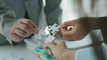 Financial analysts analyze business financial reports on a digital tablet planning investment project during a discussion at a meeting of corporate showing the results of their successful teamwork. video