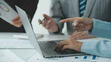 Financial analysts analyze business financial reports on a digital tablet planning investment project during a discussion at a meeting of corporate showing the results of their successful teamwork. video