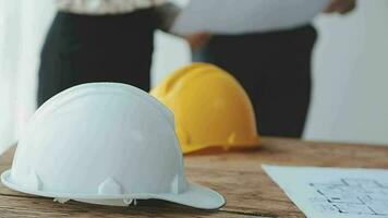 Architect and engineer construction workers shaking hands while working for teamwork and cooperation concept after finish an agreement in the office construction site, success collaboration concept video