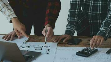 Architect and engineer construction workers shaking hands while working for teamwork and cooperation concept after finish an agreement in the office construction site, success collaboration concept video