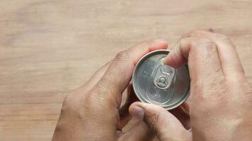 opening a can of soft drink video