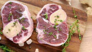 Top view of putting raw meat on chopping board video