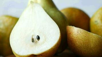 Slice of fresh pears on table close up video