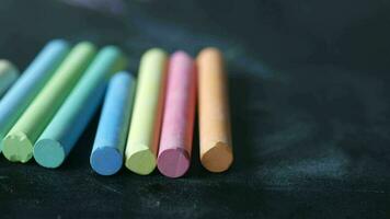 colorful chalk on black background video