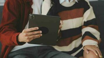 Financial analysts analyze business financial reports on a digital tablet planning investment project during a discussion at a meeting of corporate showing the results of their successful teamwork. video