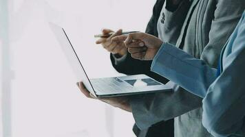 Financial analysts analyze business financial reports on a digital tablet planning investment project during a discussion at a meeting of corporate showing the results of their successful teamwork. video