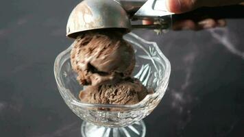 Hand picking ice cream with a spoon from a bowl video