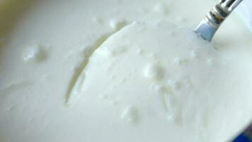 Fresh yogurt in a bowl on table video