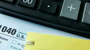 Close up of a Tax return form and pen on table video