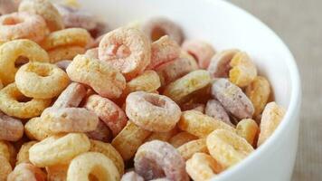 Close up of colorful cereal corn flakes in a bowl video