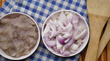 red onion in a bowl on table video